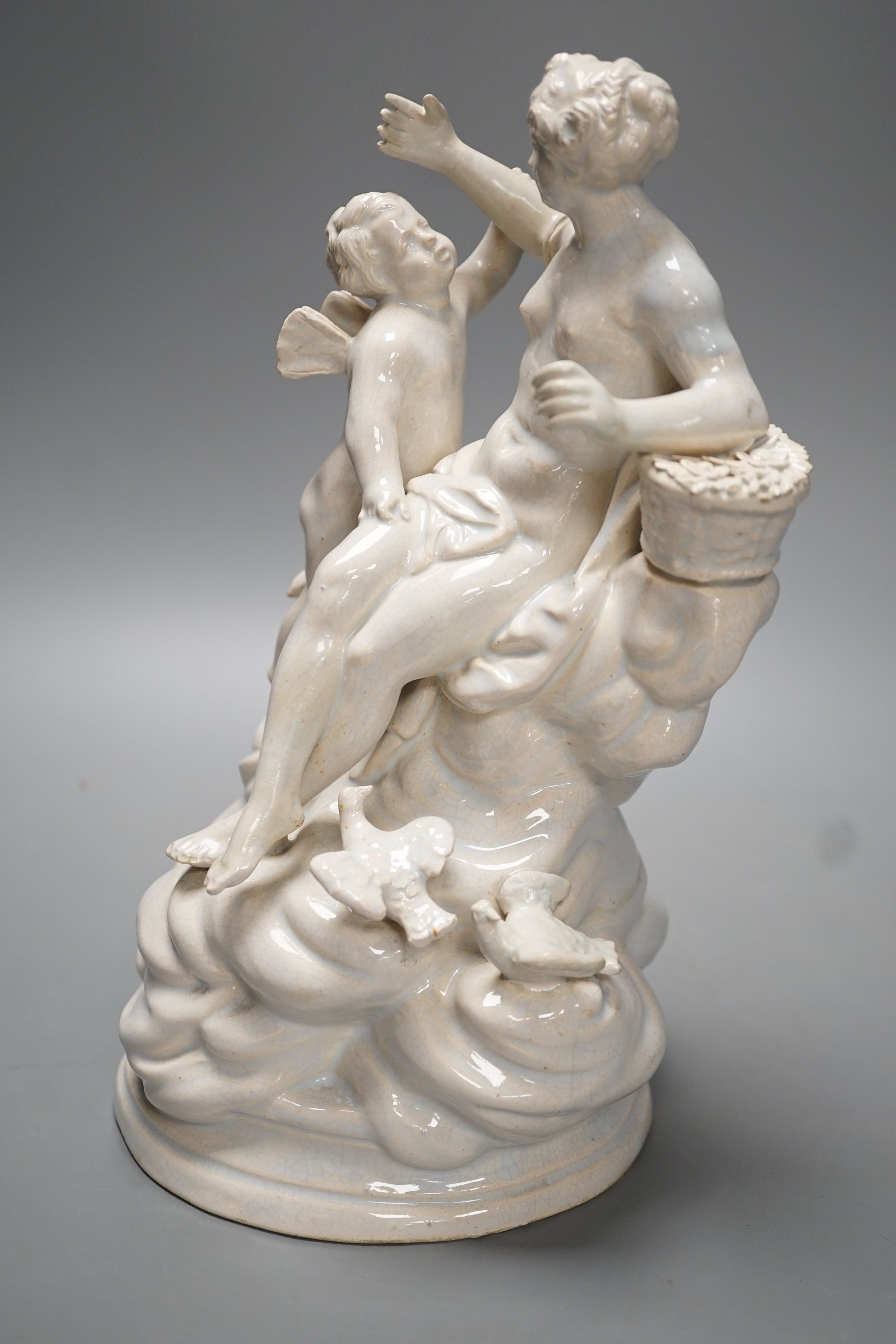 A 19th century Naples style maiolica group of Venus and Cupid - 26.5cm high